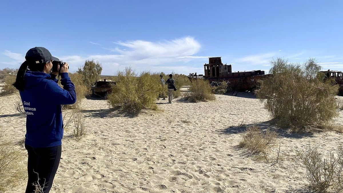 Rusting remains of fishing boats stranded on the dried-out seabed of the former Aral Sea