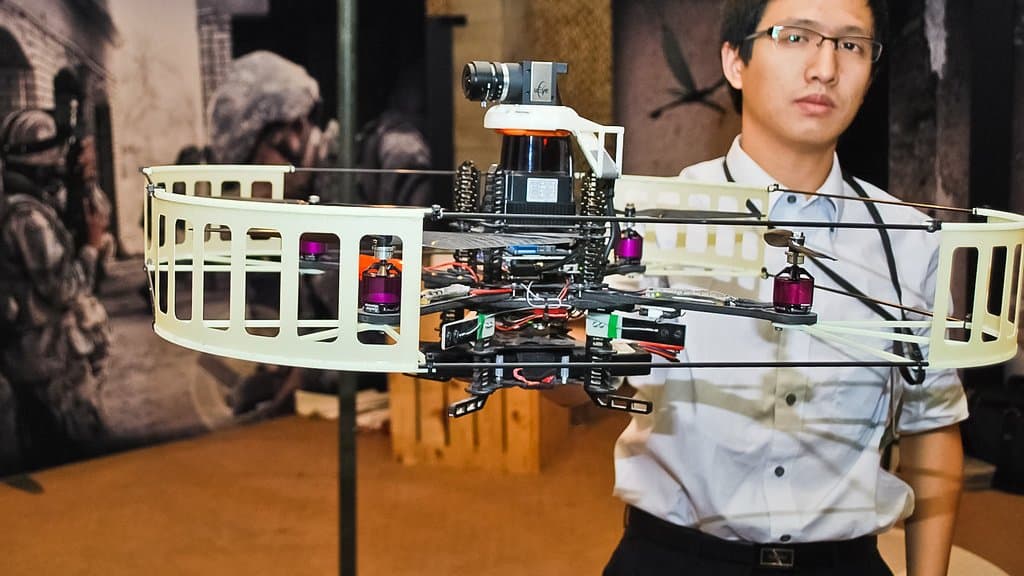 Researchers in a laboratory working on microscale robotics