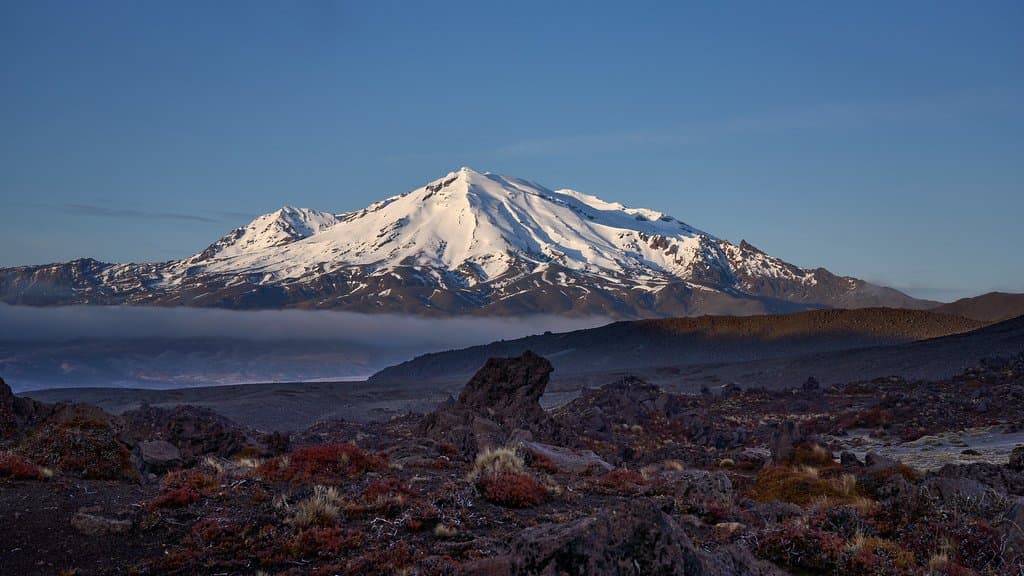 Snow-covered Mount Ruapehu volcano in New Zealand at sunrise