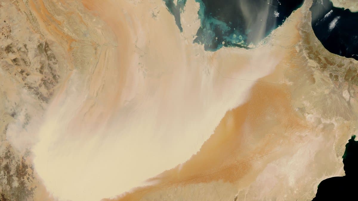 A large dust storm sweeping across the Arabian Peninsula, seen from above