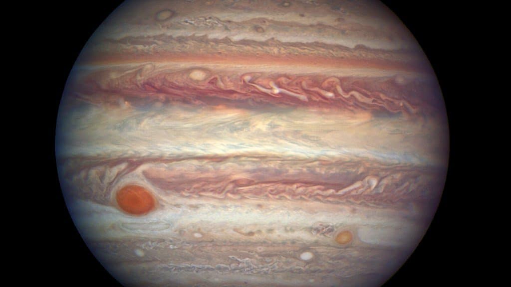 A close-up portrait of Jupiter showing its banded cloud belts and the Great Red Spot.