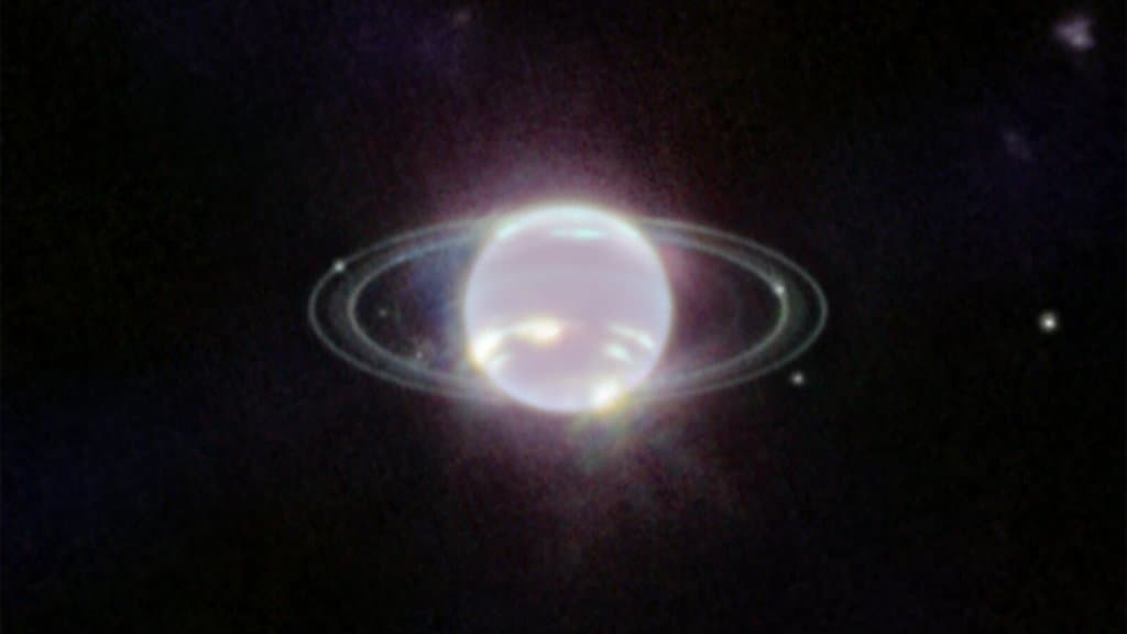 Webb infrared image of Neptune showing its thin bright rings and several small moons as points of light