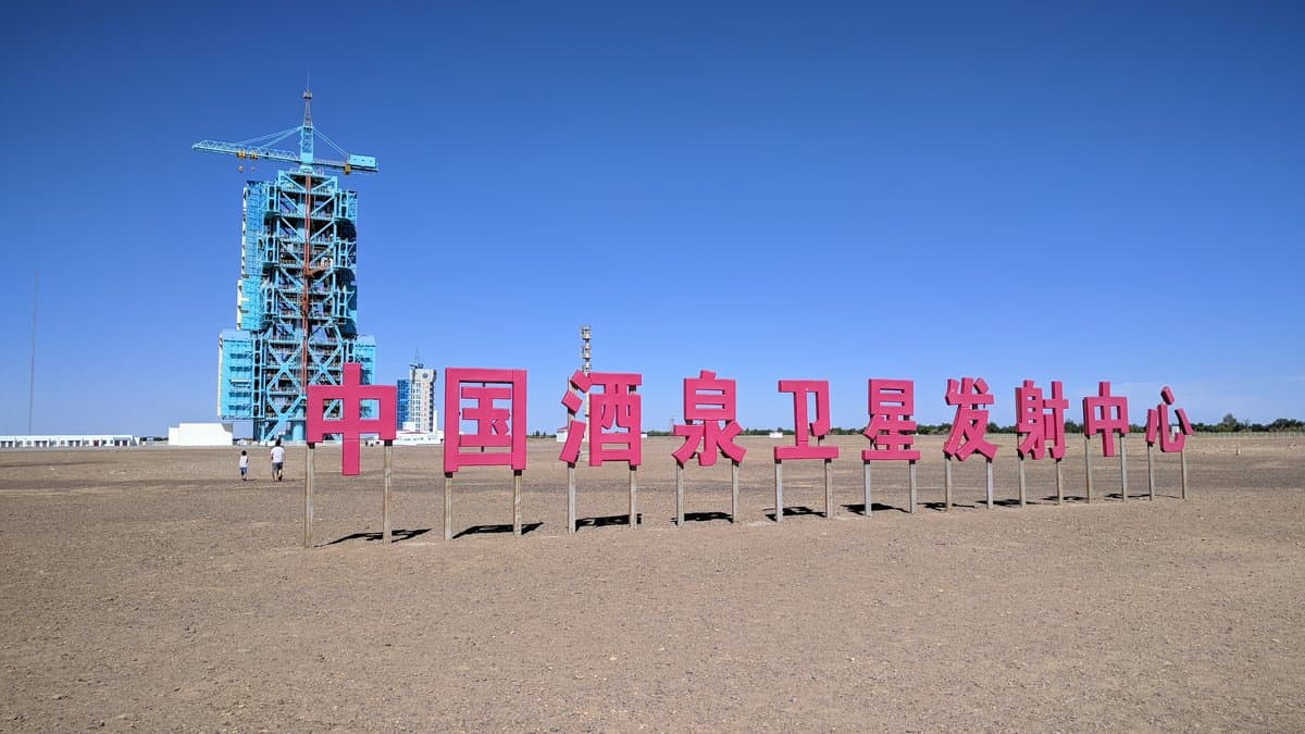 A launch tower and site sign at the Jiuquan Satellite Launch Center in the northwestern Chinese desert