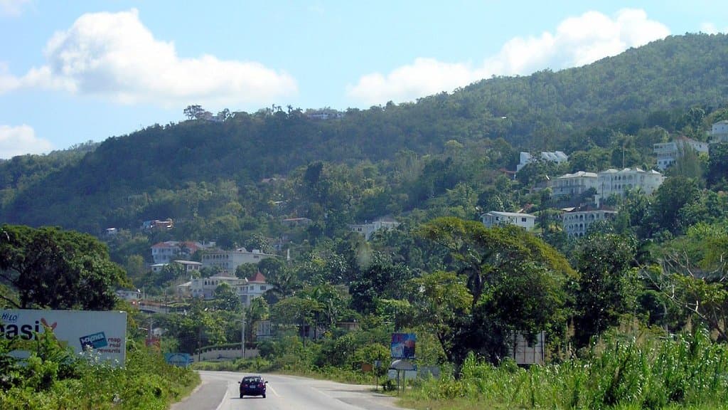 Green hilly countryside in Jamaica seen from the road between Negril and Montego Bay.