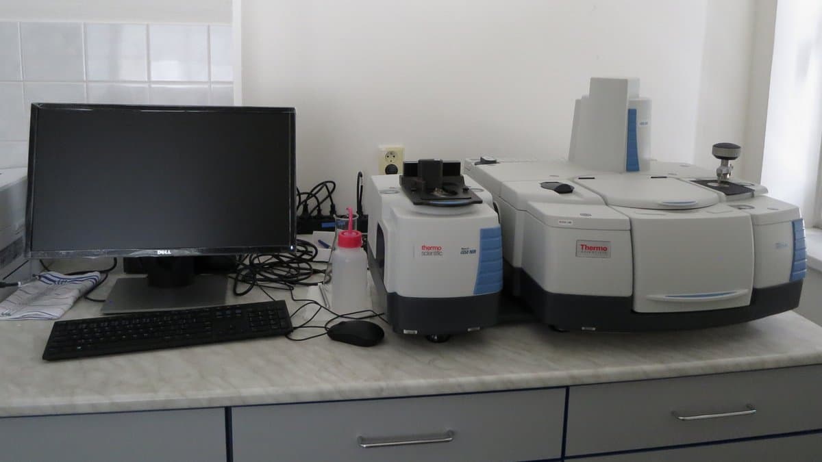 A benchtop infrared spectrometer standing on a laboratory bench