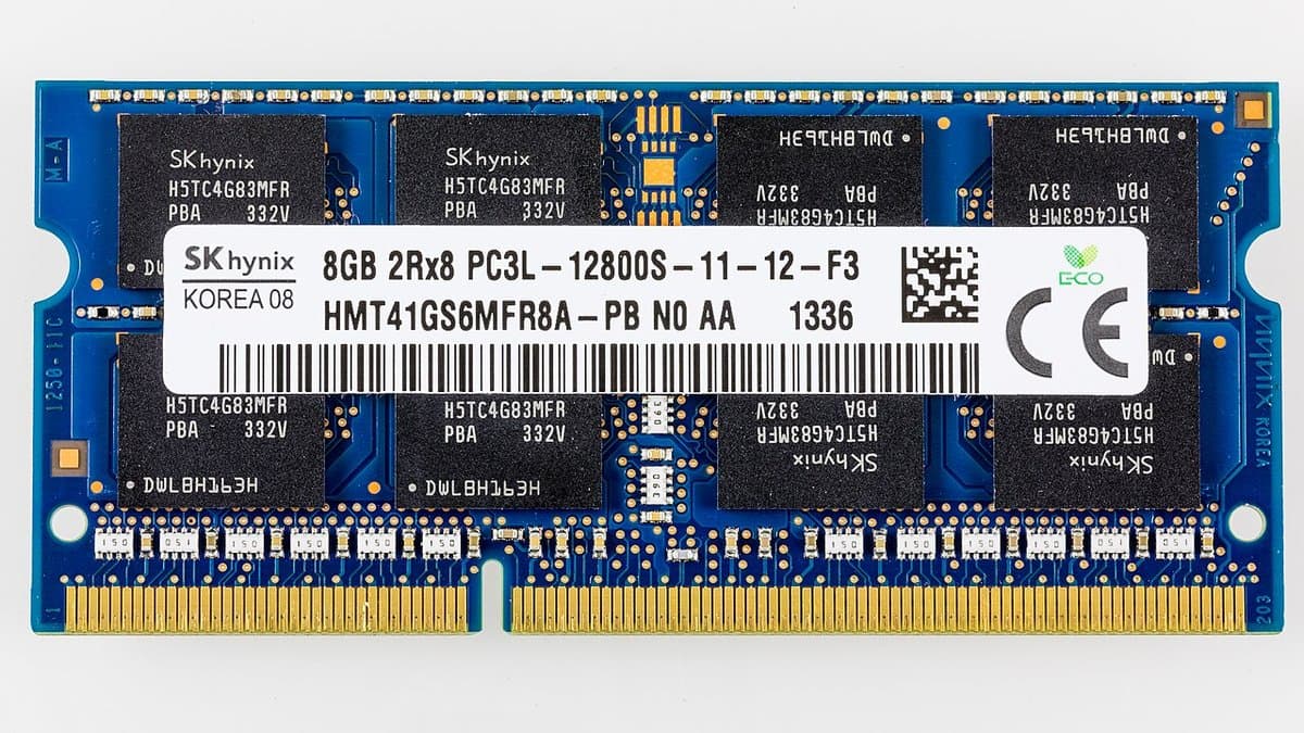 A blue SK hynix laptop memory module photographed flat against a white background, showing eight black DRAM chips, a white part-number label and a gold-contact edge connector.