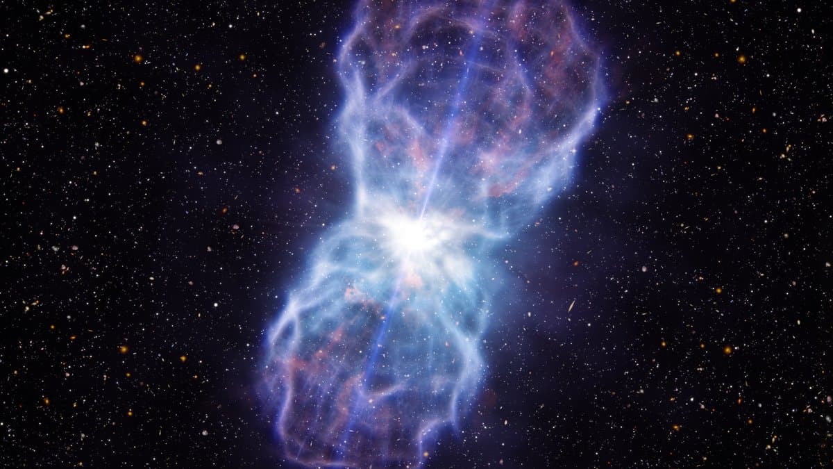Artist's impression of a quasar: a brilliant white point of light at a galaxy's core, with vast blue and pink lobes of gas driven outwards into a field of stars.