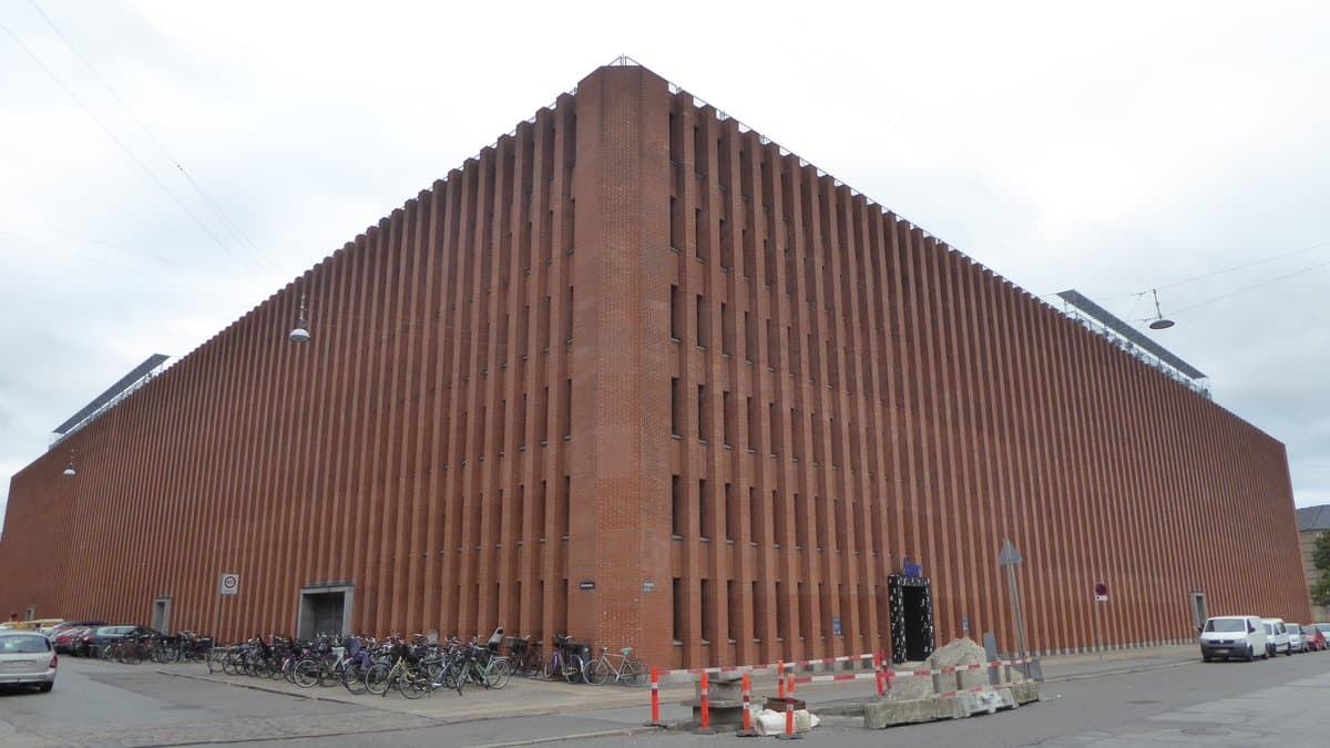 The red brick headquarters of Statistics Denmark in Copenhagen, seen from a street corner.