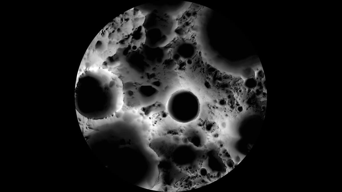 Grayscale visualization of the Moon's south pole, with bright ridges and crater floors that are completely black.