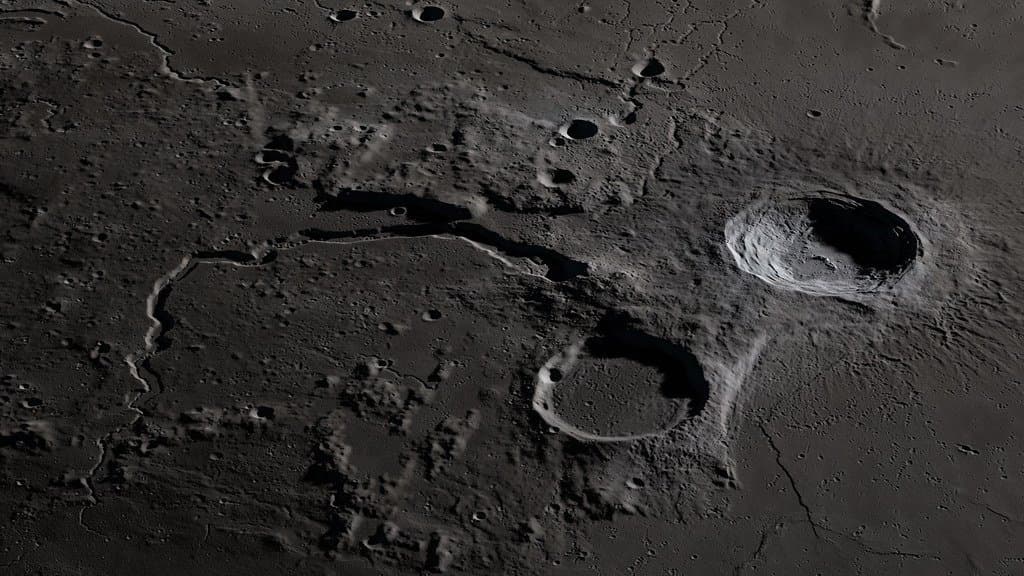 An oblique view of the Moon's Aristarchus plateau, showing a bright crater and a winding channel cut by ancient lava flows.