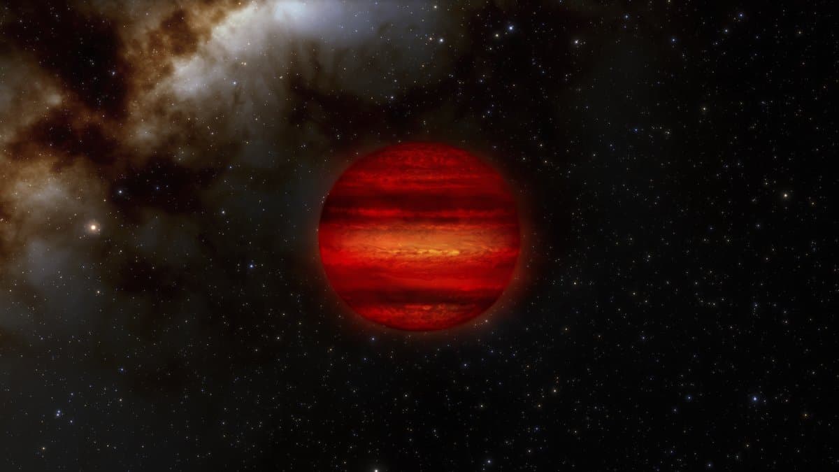 Artist's concept of a brown dwarf, a banded red world glowing against a starfield and a distant nebula.
