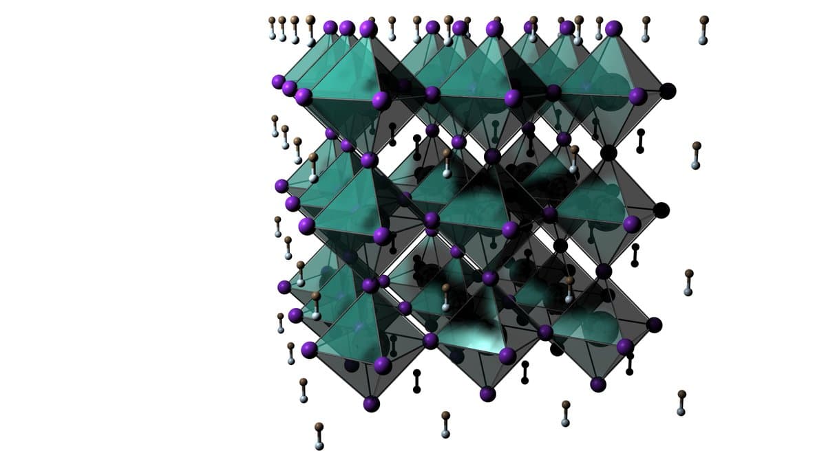 A computer model of a perovskite crystal structure, showing linked octahedra of the inorganic framework with smaller ions and molecules in the spaces between them.