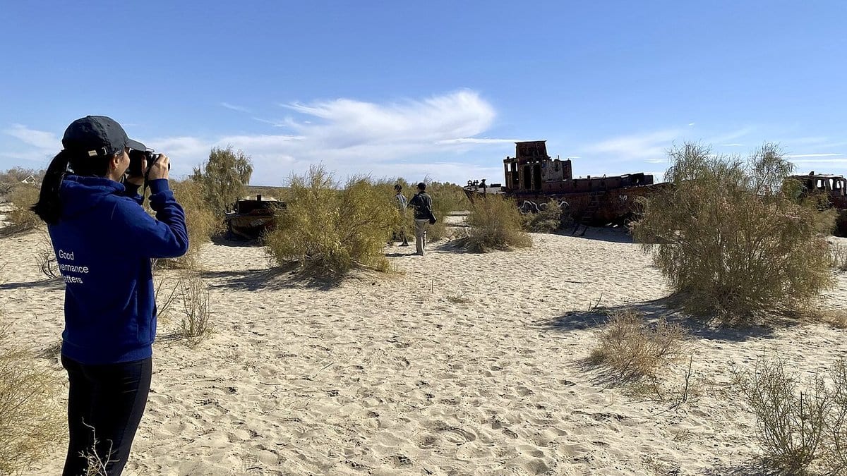 Rusting remains of fishing boats stranded on the dried-out seabed of the former Aral Sea