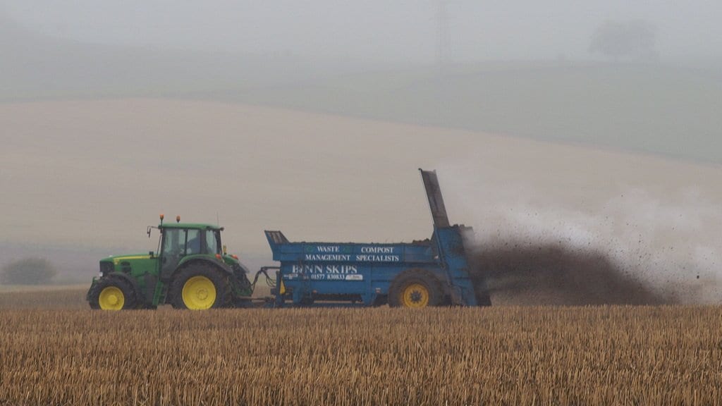 Fertiliser spread across an agricultural field