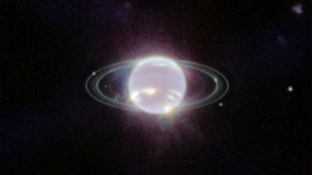 Webb infrared image of Neptune showing its thin bright rings and several small moons as points of light
