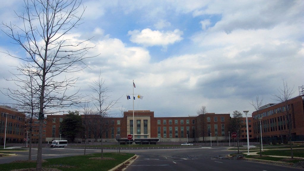 The U.S. Food and Drug Administration's White Oak campus in Silver Spring, Maryland, with flags flying in front of the main building.