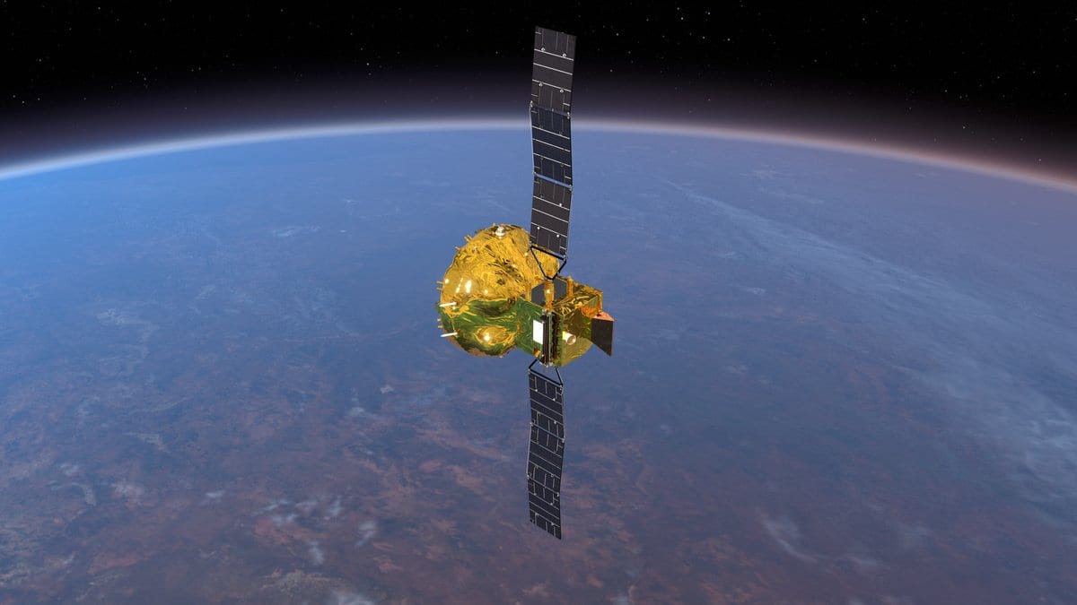 Artist's impression of the Smile spacecraft in orbit above Earth, its long solar panels deployed either side of a gold-wrapped payload module.