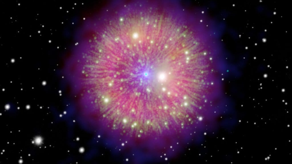 A round nebula of pink and purple light with hundreds of fine filaments radiating from a bright central star, set against a black field of stars.