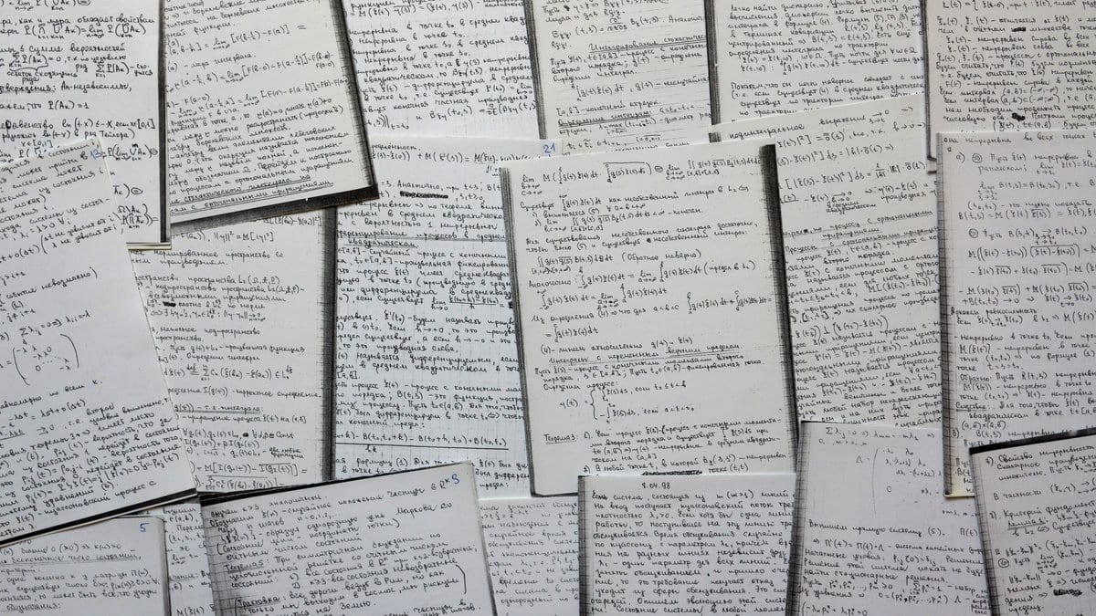 A wall covered with rows of handwritten pages densely filled with mathematical formulas and symbols.