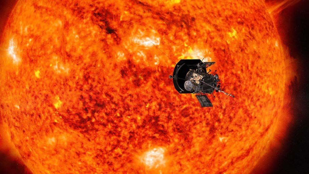An agency rendering of the Parker Solar Probe spacecraft, heat shield forward, against the mottled orange face of the Sun.