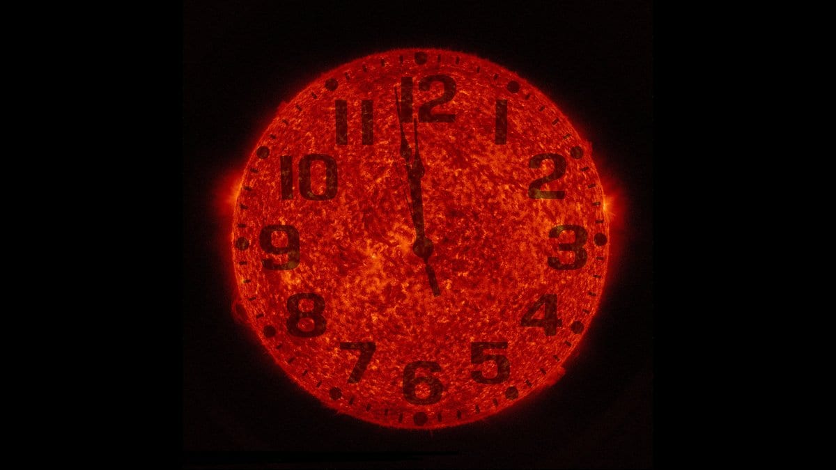 A composite picture of the Sun's disk overlaid with the numerals and hands of a clock face.