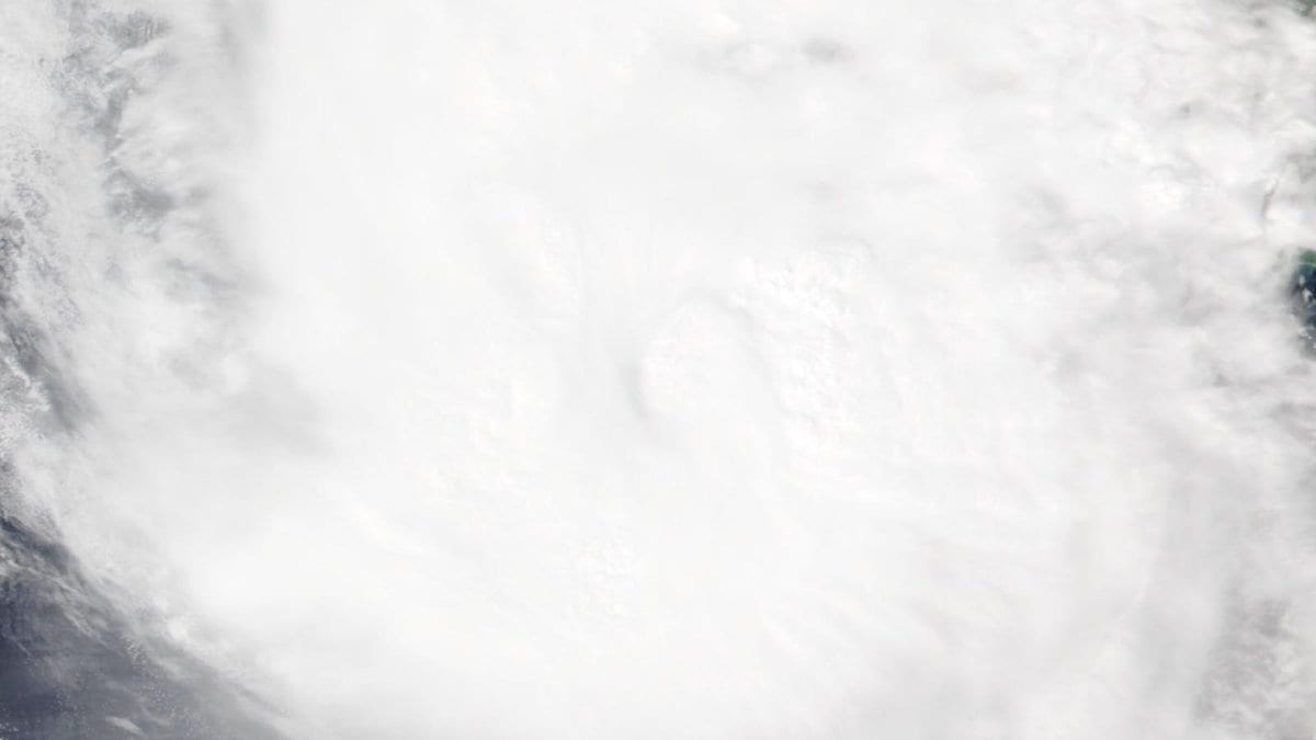 Satellite view of Hurricane Trudy's circular cloud mass over open water off Mexico's Pacific coast