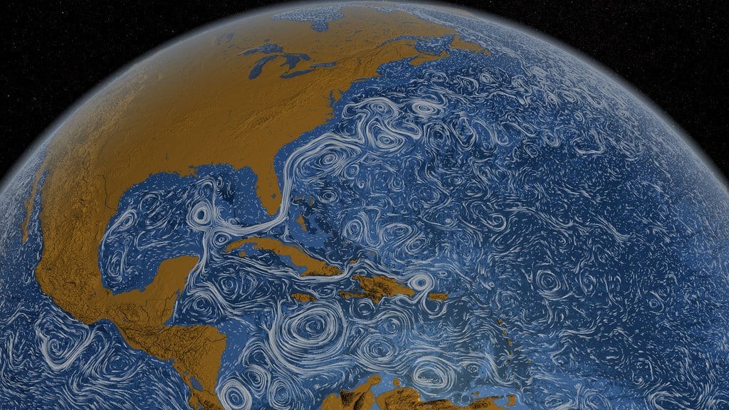 Visualization of ocean surface currents in the North Atlantic, white streamlines swirling over dark blue water, with the Gulf Stream curving north past the eastern United States.