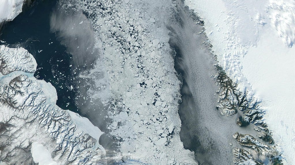 Satellite true color view of Baffin Bay, with pack ice filling the water between the snow-covered coasts of Baffin Island and Greenland.