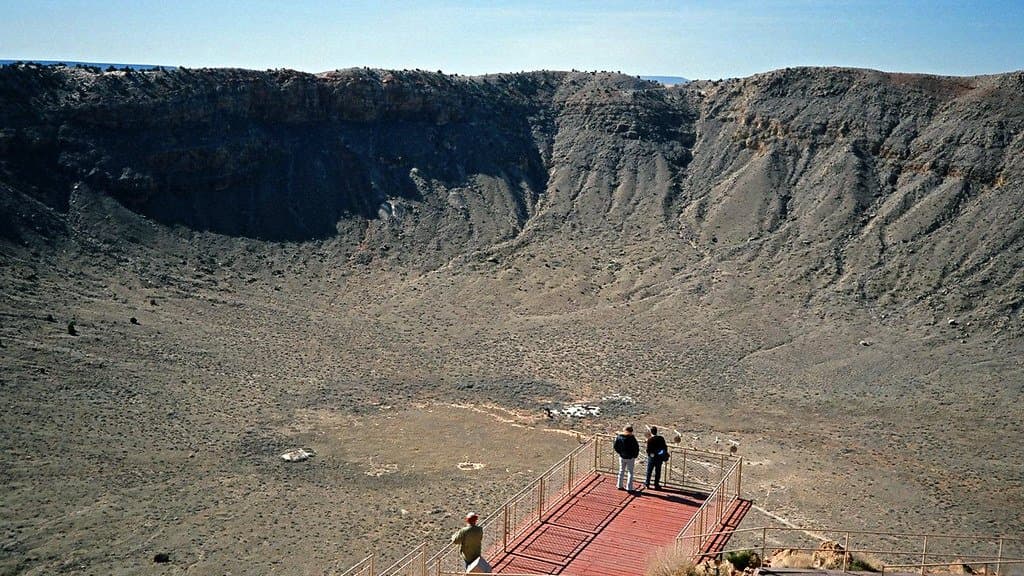 View inside a large meteorite impact crater, its excavated rim exposing rock layers