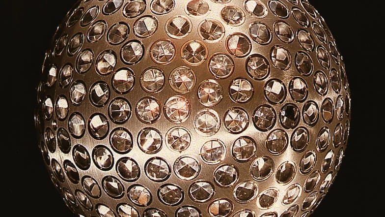 The spherical LAGEOS geodetic satellite covered in retroreflector prisms